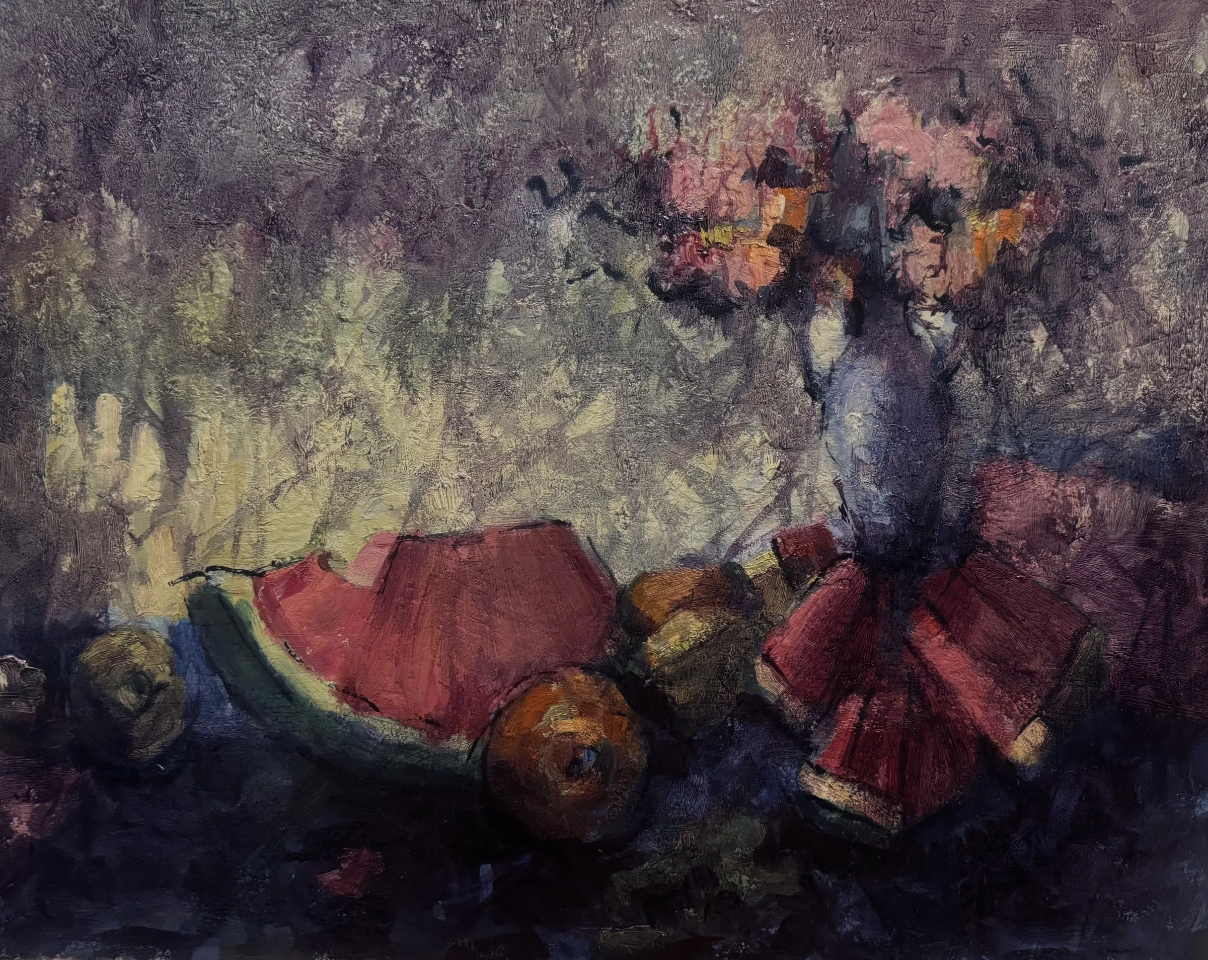 Bouquet in a dark vase above watermelon and fruit