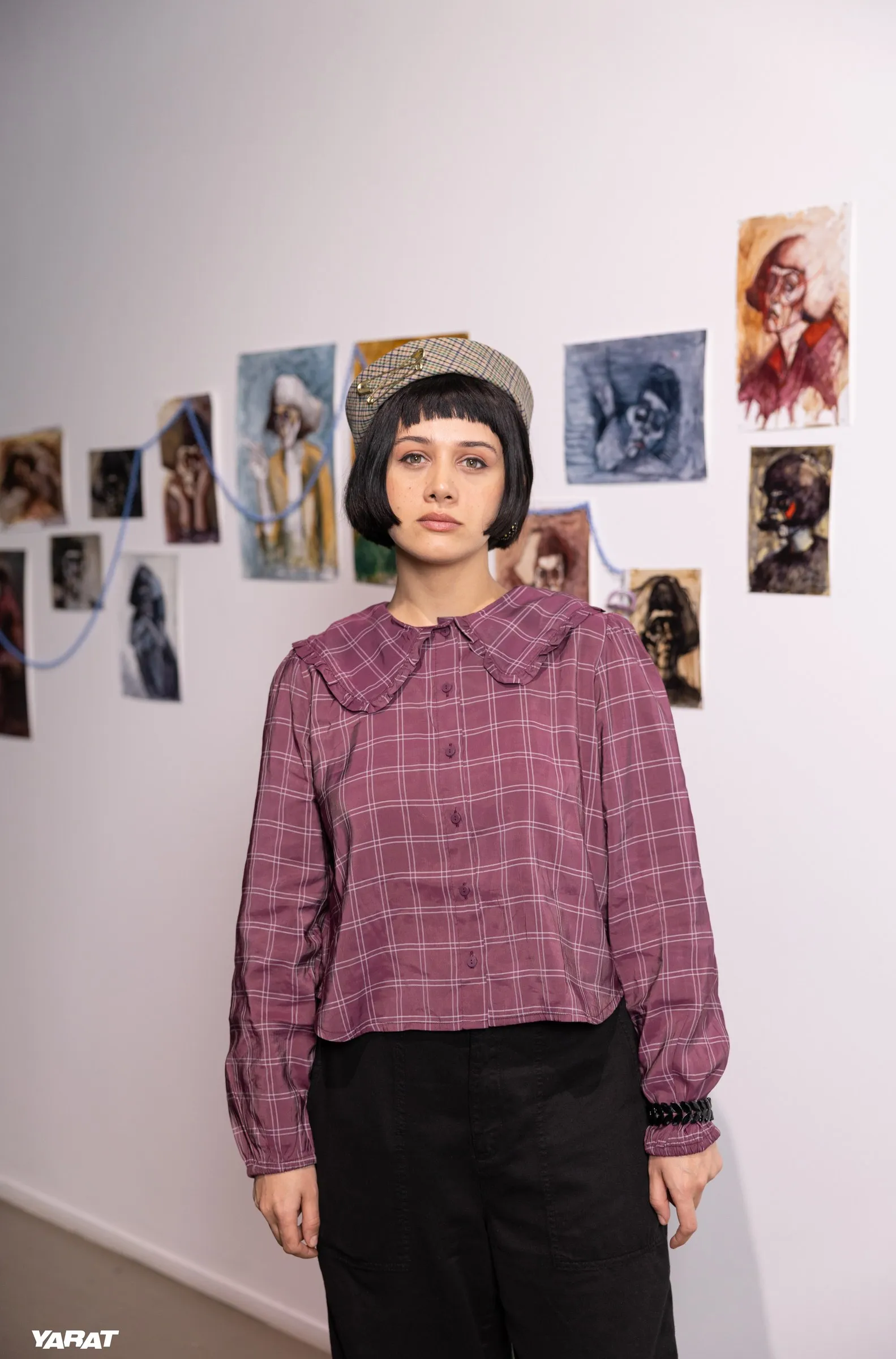 Chinara Chi standing in front of her works at MATRIX
