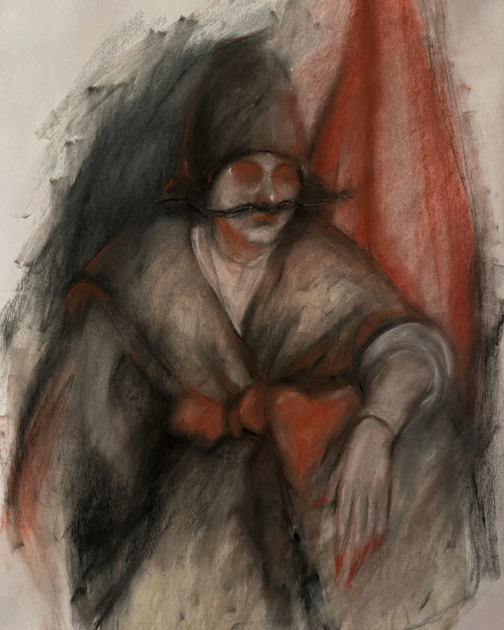 Charcoal figure against a red drape, the face left nearly blank