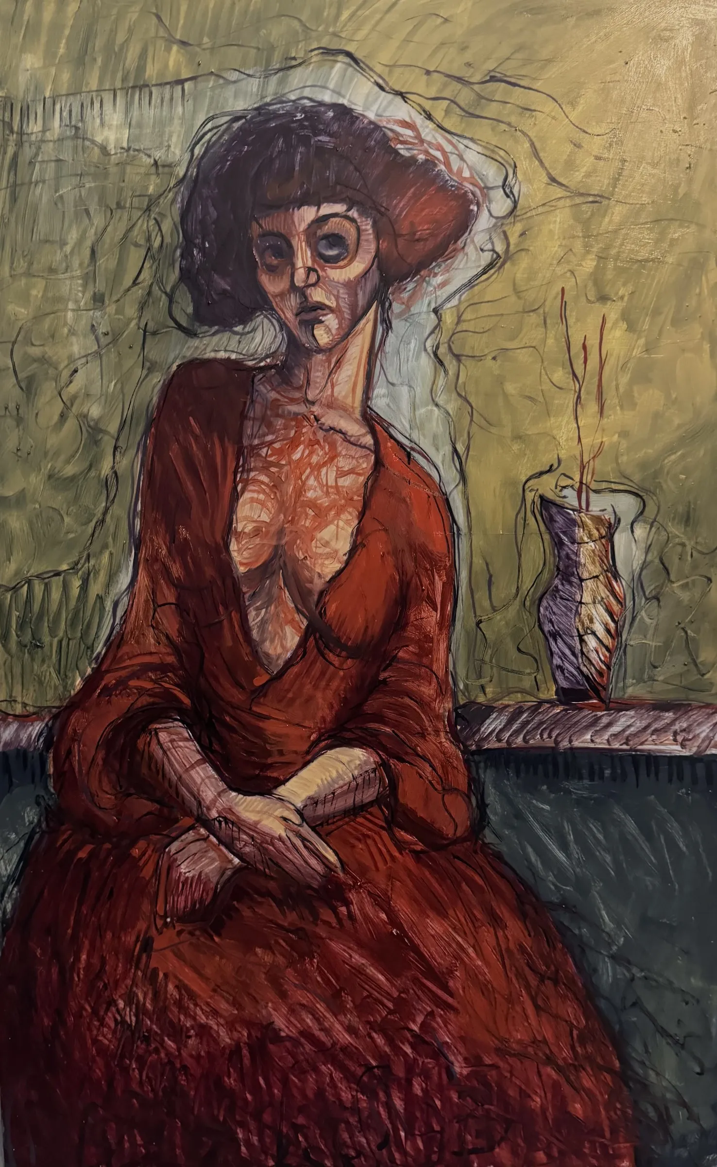 Seated woman in a red dress, a vase on the table behind
