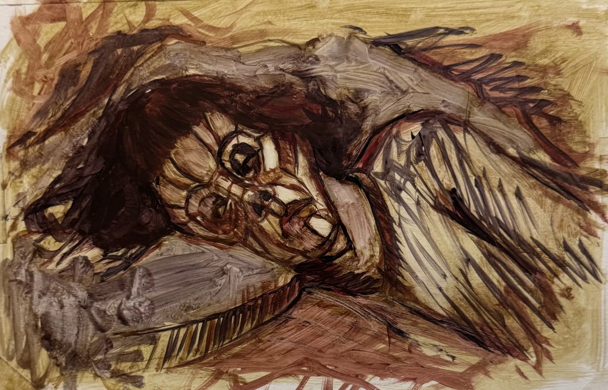Head lying down, ochre and brown, eyes wide