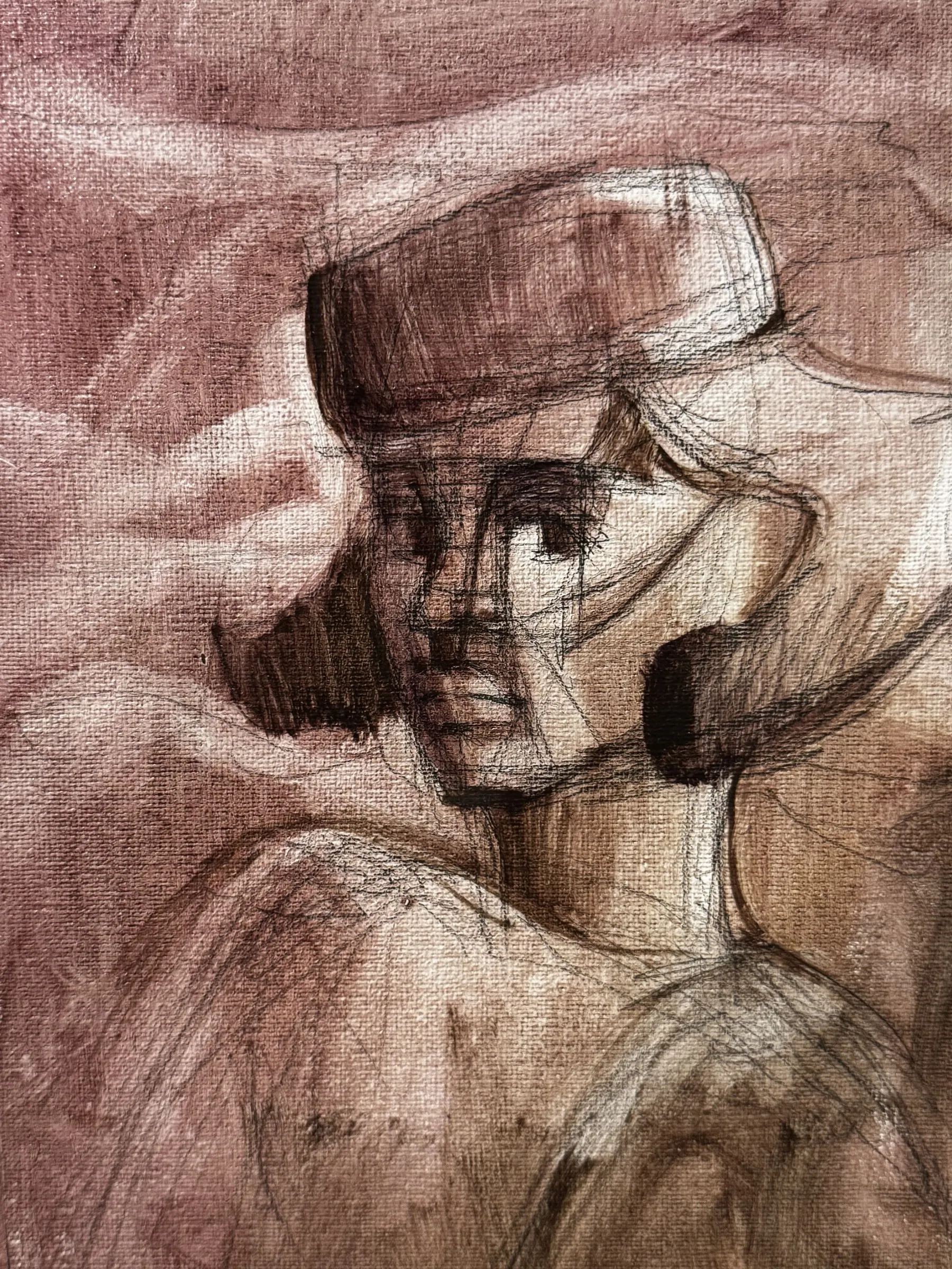 Pale pink and brown head wearing a soft hat