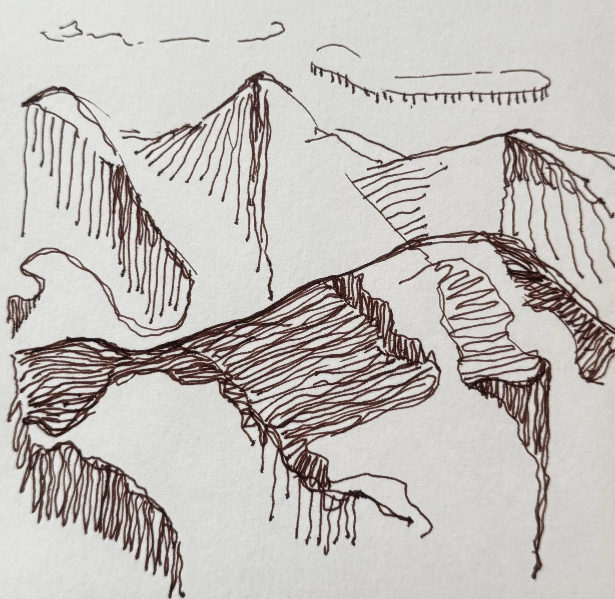Ink sketch: outlined mountain ridges in brown line